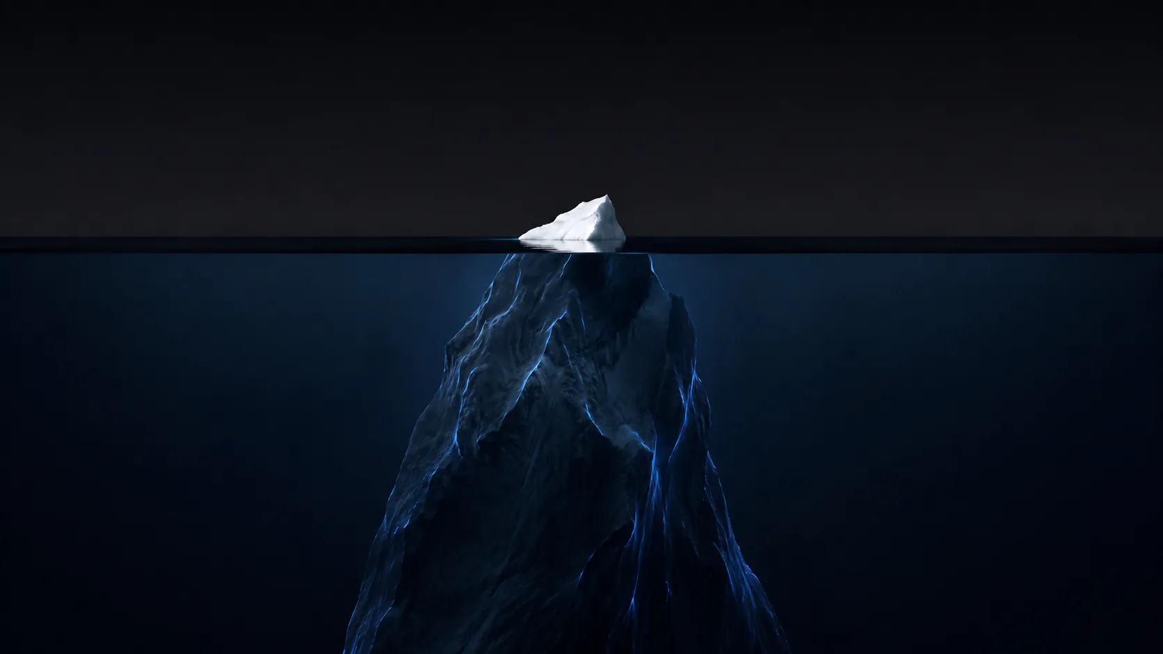 An iceberg: a small white tip above the waterline, a vast dark mass beneath it